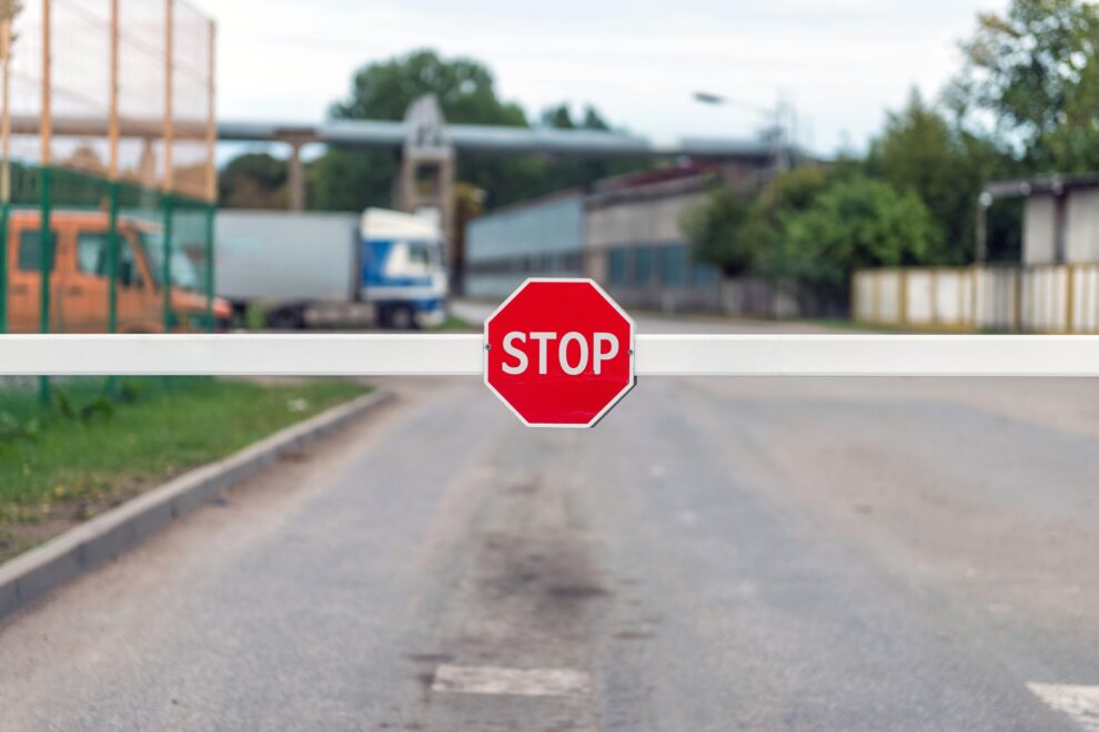 Automatic barrier with a STOP sign.