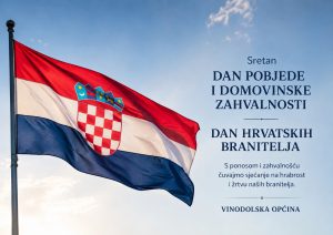 Croatian flag waving beside a blue banner that commemorates Victory and Homeland Thanksgiving Day and Croatian defenders.